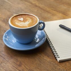 blue mug with latte foam design